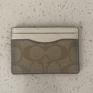 Never used Coach cream and gold mini wallet.